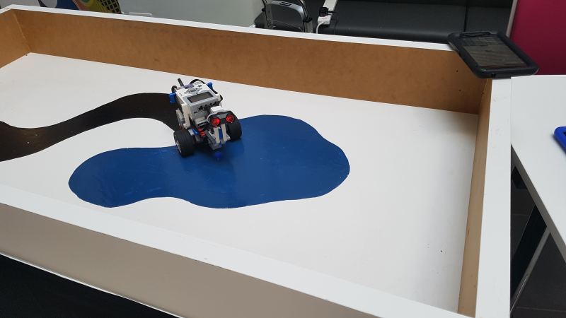 Picture of a Lego Rover searching for water (by detecting a blue surface)
